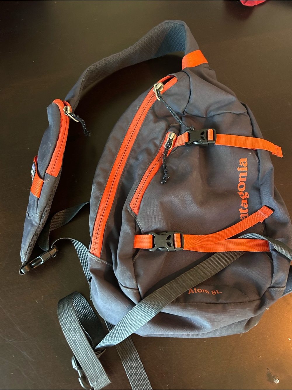 Patagonia Navy Sling Pack with Orange Accents